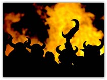 Locals dressed in costume are silhouetted against a burning replica Viking galley in Lerwick during the Up Helly Aa Festival on the Island of Shetland in Scotland January 28, 2003. - Reuters Photo